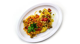Spaghetti with a Sicilian olive blend and a fish filet